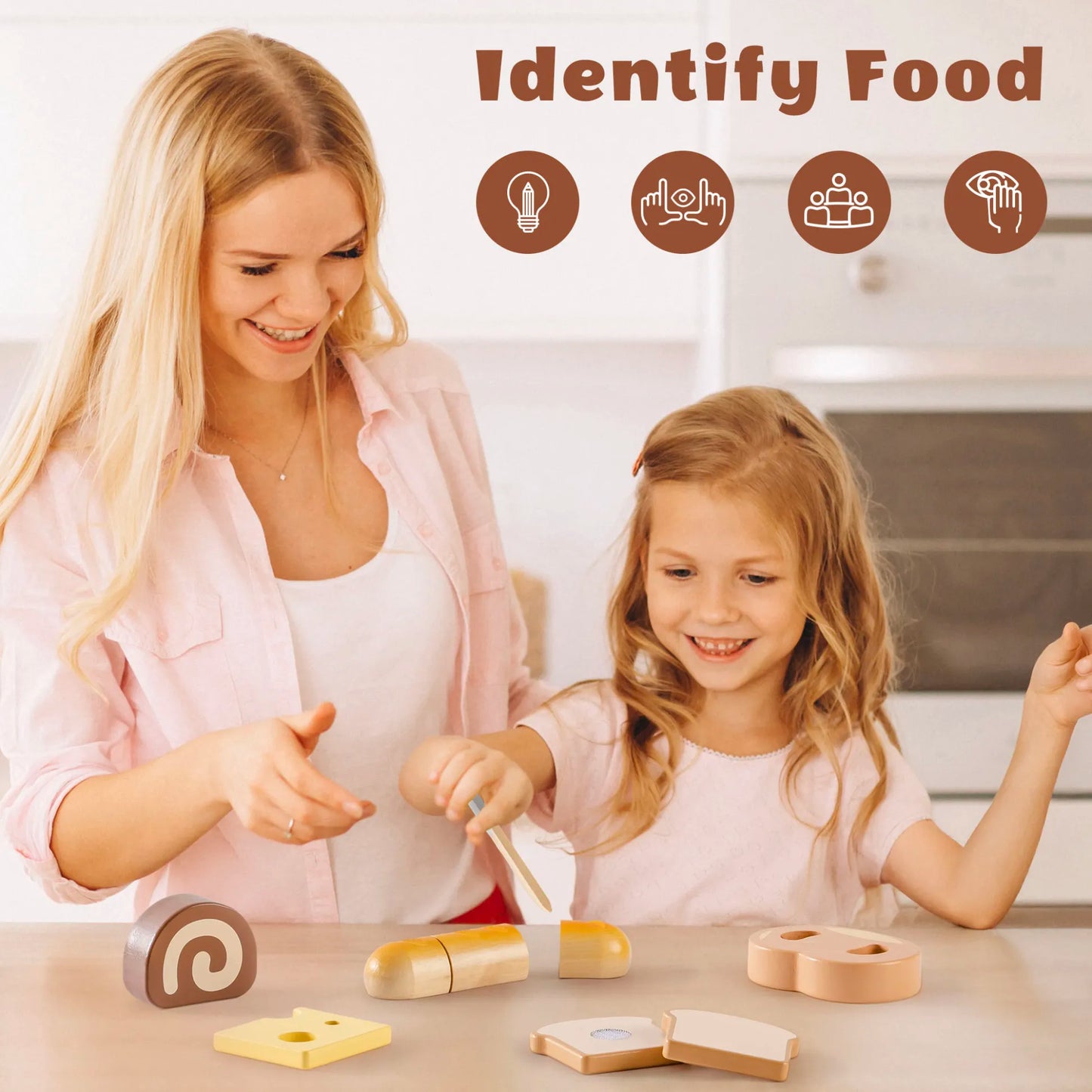 Woman and young girl playing with wooden food toys on a table.