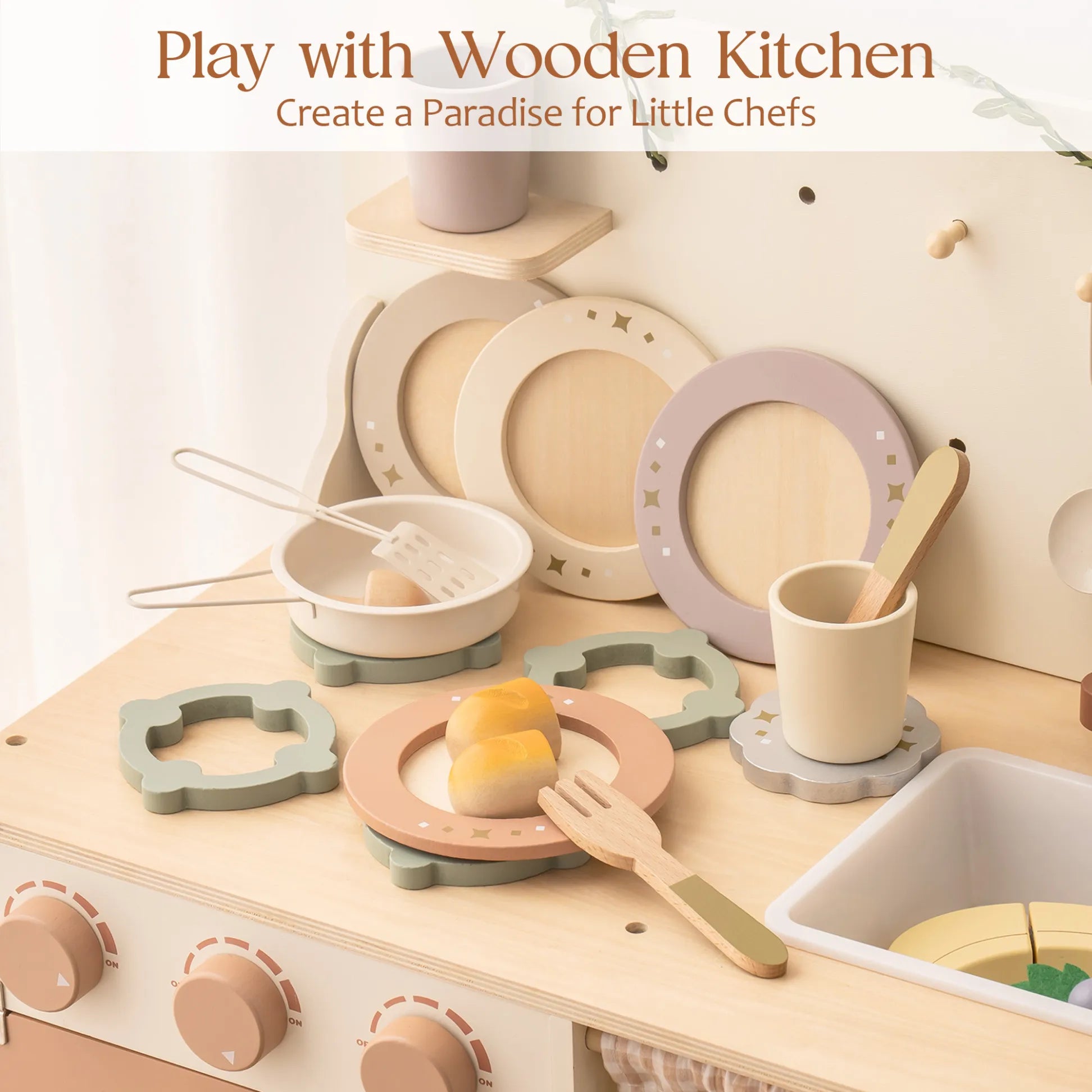 Wooden kitchen playset with plates, cups, and utensils on a countertop.